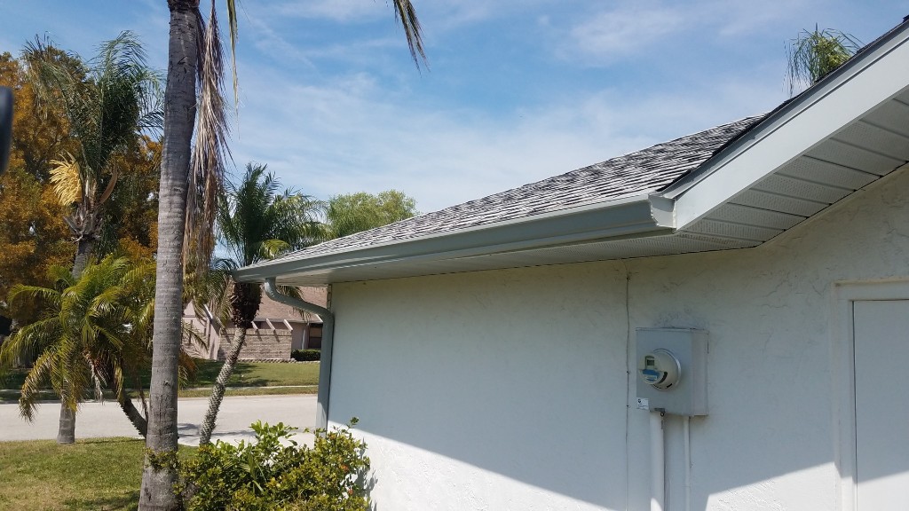 Finished gutter replacement corner detail on a Tampa home